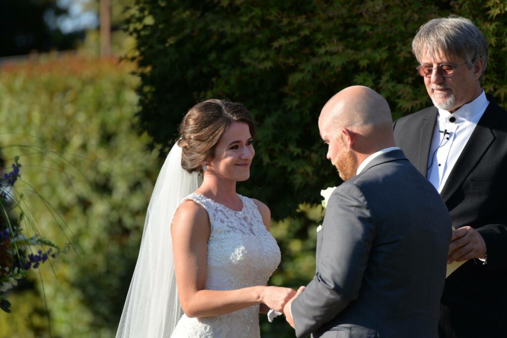 A photo of a Bride and Groom saying "I do" on their Wedding Day at Vista Ranch and Cellars Merced CA