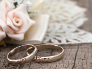 A photo of Wedding rings and flowers