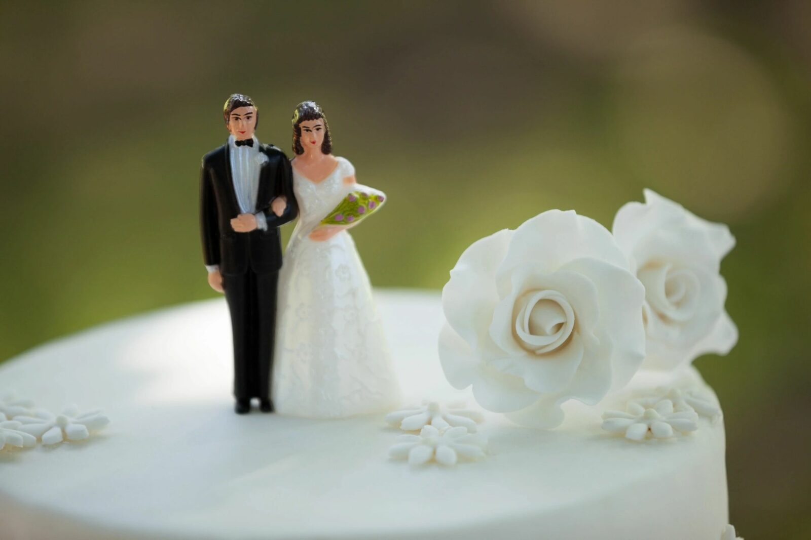 a photo of a Bride and Groom Wedding Cake Topper