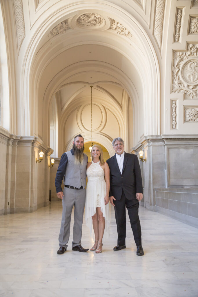 A photo of the Officiant with Couple at a San Francisco City Hall Wedding