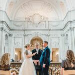 A photo of a bride reading her vows at her Wedding on the Mayor's Balcony at San Francisco City Hall