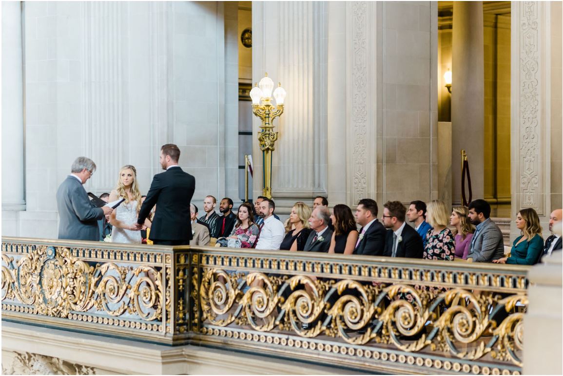 A photo of Andrew Allen officiating a wedding on the mayor's balcony San Francisco City Hall