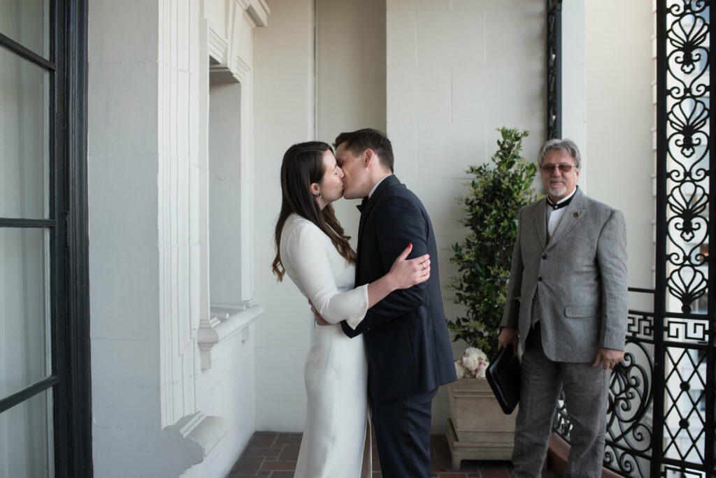 A photo of a couple exchanging their First Kiss of their Elopement