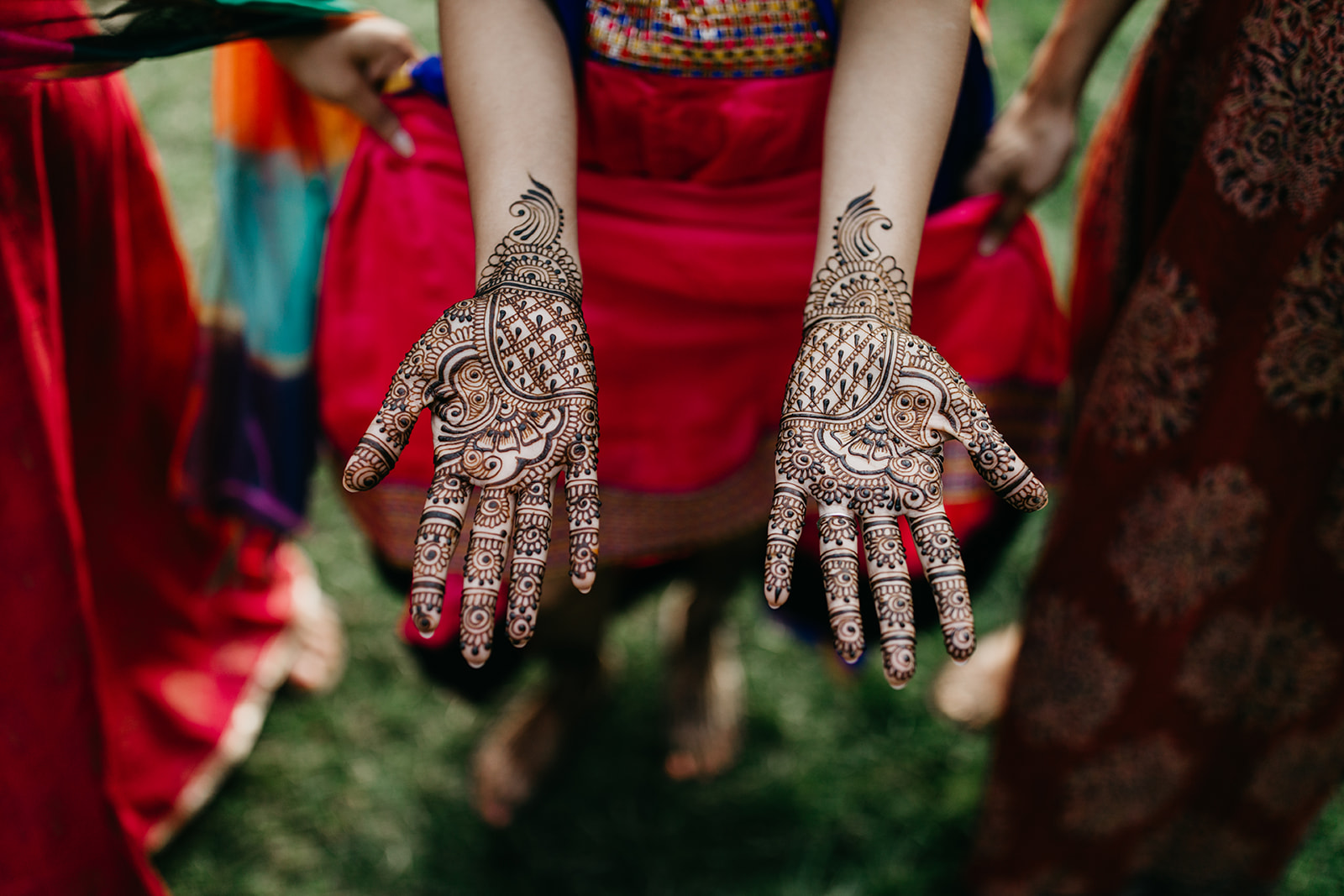 A photo of a bride shows off her Hands with Henna Mehndi for Wedding