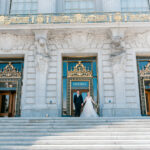 A photo of a couple Celebrating their wedding at SF City Hall