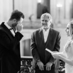 A photo of Bride reciting her wedding vows during a wedding on the Mayor's Balcony in San Francisco City Hall.