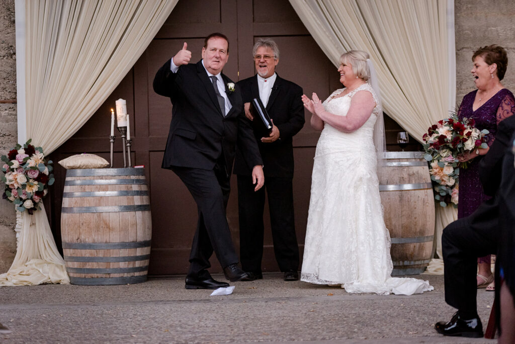 A photo of a Groom stomping on the glass during a Jewish Interfaith Wedding