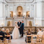 Bride and groom with Officiant